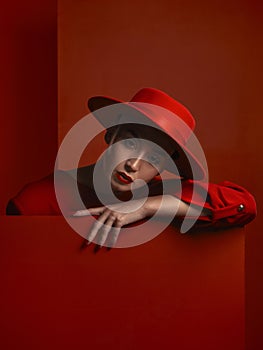 Fashion, portrait and a vintage woman on a red background for a sexy or creative aesthetic. Retro, rich and an elegant