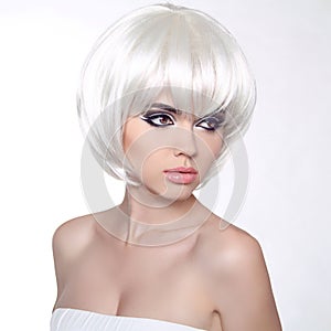 Fashion portrait with White Short Hair. Haircut. Hairstyle. Fringe. Professional Makeup. Make-up. Vogue Style Woman isolated on W