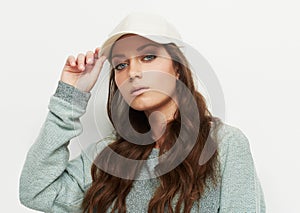 Fashion, portrait and woman with a cap in studio with attitude, confidence or casual style on white background. Trendy
