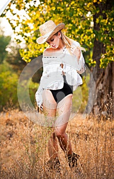 Fashion portrait woman with hat and white shirt in the autumn day