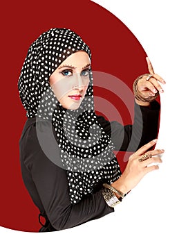 Fashion portrait of young beautiful muslim woman with black scar
