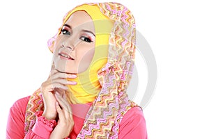 Fashion portrait of young beautiful muslim woman with pink costu