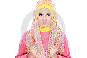 Fashion portrait of young beautiful muslim woman with pink costu