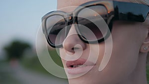 Fashion Portrait of Young Beautiful Sensual Blonde Woman In Sunglasses Outdoors