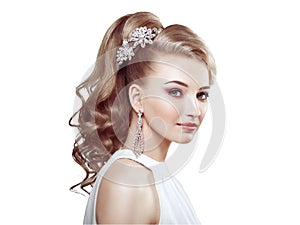 Fashion portrait of young beautiful woman with elegant hairstyle