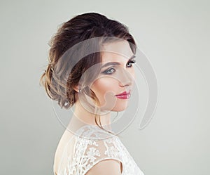 Fashion portrait of young beautiful woman face. Perfect makeup, bridal hairstyle