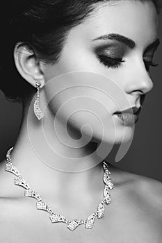 Fashion portrait of young beautiful woman with jewelry