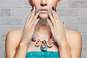 Fashion portrait of young beautiful woman over bricks wall