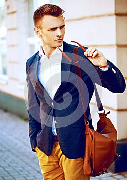 Fashion portrait of a young casual man looking away