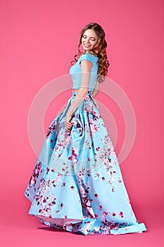 Fashion portrait of young girl in bright dress