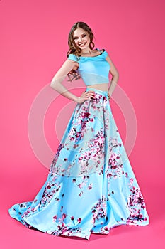 Fashion portrait of young girl in bright dress