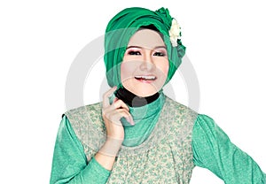 Fashion portrait of young happy beautiful muslim woman with gree