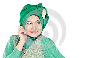 Fashion portrait of young happy beautiful muslim woman with gree