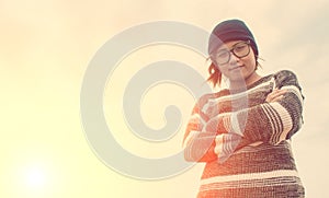 Fashion portrait of young hipster woman with hat and sunglasses