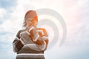 Fashion portrait of young hipster woman with hat and sunglasses