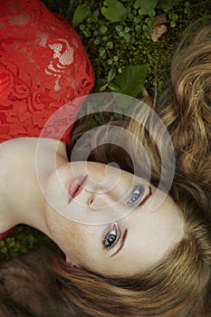 Fashion portrait of young sensual woman in garden