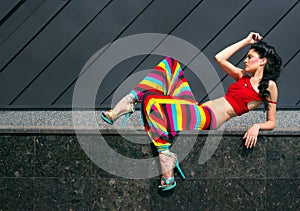 Fashion portrait of young woman in color outfit photo