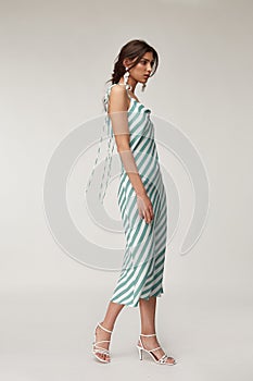 Fashion pretty woman beautiful makeup perfect body shape tanned skin wear clothes summer collection organic textile blue stripes