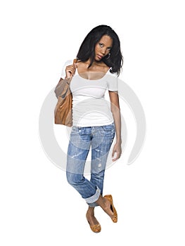 Fashion - pretty woman in jeans with bag