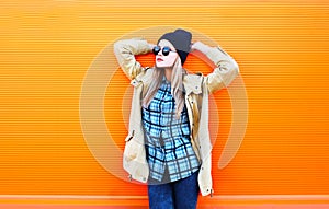 Fashion pretty woman model over orange background
