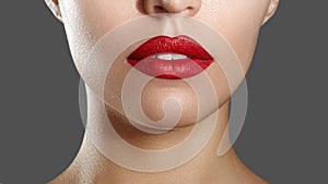 Fashion Red Lip Makeup. Bright Lipstick on Lips. Closeup of Beautiful Female Mouth. Part of Woman Face. Horizontal