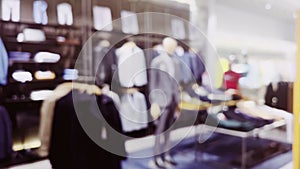 Fashion, retail and shop, blurred interior view of apparel clothing store in luxury shopping mall as defocused