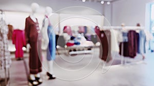 Fashion, retail and shop, blurred interior view of apparel clothing store in luxury shopping mall as defocused