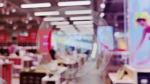 Fashion, retail and shop, blurred interior view of footwear shoe store in luxury shopping mall as defocused background