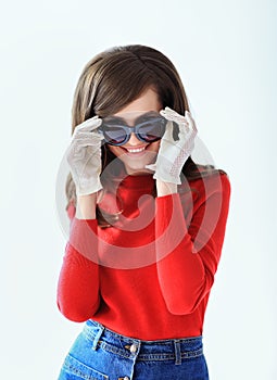 Fashion retro style portrait of young beautiful woman in sunglas