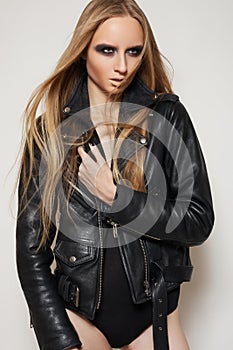 Fashion rock woman in black leather jacket & body