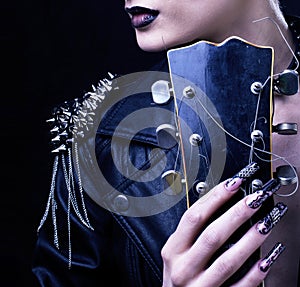 Fashion Rocker Style Model Girl Portrait. Hairstyle. Punk Woman Makeup, Hairdo and black Nails. Smoky Eyes