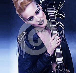 Fashion Rocker Style Model Girl Portrait. Hairstyle. Punk Woman Makeup, Hairdo and black Nails. Smoky Eyes hairstyle