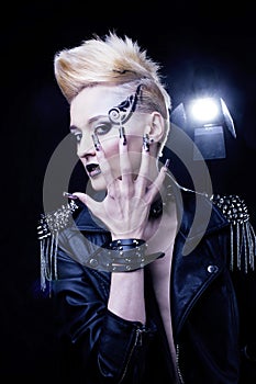 Fashion Rocker Style Model Girl Portrait. Hairstyle. Rocker or Punk Woman Makeup, Hairdo and black Nails. Smoky Eyes in