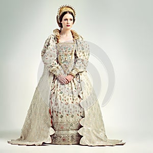 Fashion, royal and victorian queen in studio with a renaissance, luxury and fancy dress. Royalty, beauty and medieval