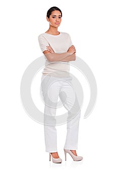 Fashion, serious woman and portrait with arms crossed in studio for confidence, attitude or style on white background