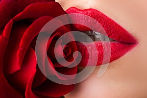 Fashion sexy woman with flowers. Vogue style model girl face with roses. Beautiful woman lips with rose.