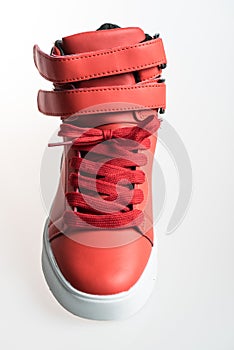 Fashion shoes with shoestring. Red sneaker and shoelace