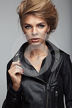 Fashion shoot of girl with beautiful hair style in a leather jacket.