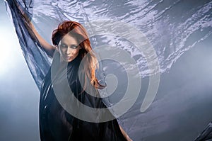 Fashion shoot of a young redhead Caucasian woman