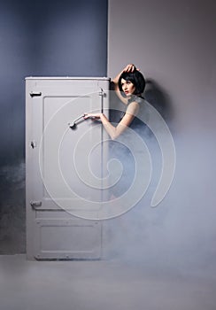 Fashion shoot of a young woman in a black dress