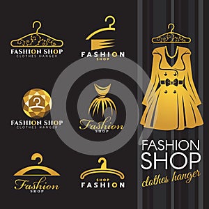 Fashion shop logo - Gold winter dress and Clothes hanger logo vector set design