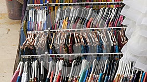 Fashion and shopping concept. Colorful women's clothes on the hangers