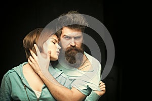 Fashion shot of couple after haircut. Hairstyle concept. Man with stylish beard and mustache and girl with fresh haircut