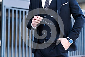 Fashion shot of a handsome man in elegant classic suit