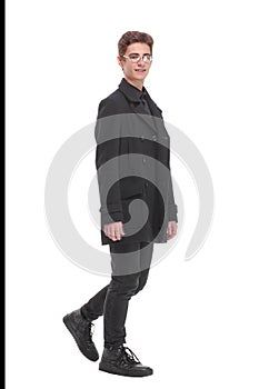 Fashion shot of a young man in black coat on white background