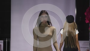 Fashion show design female clothes woman slow motion on podium close up stage 4K