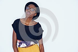 Fashion, space and portrait of black woman with attitude in studio on white background for hipster style. Model, glasses