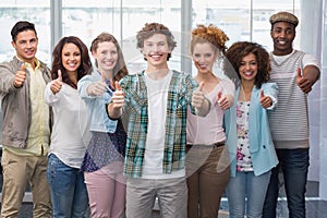 Fashion students smiling at camera together