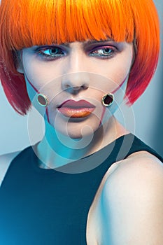 Fashion studio portrait of redhair model photo