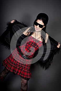 Fashion style photo of young woman in studio